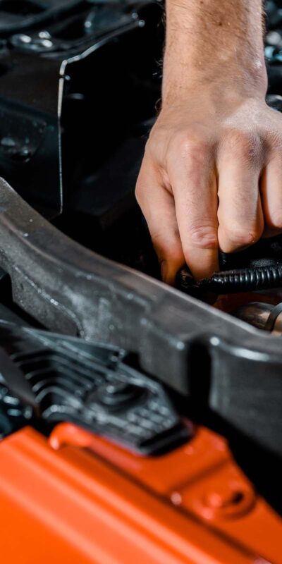 cropped shot of auto mechanic checking automobile PR973E2 1